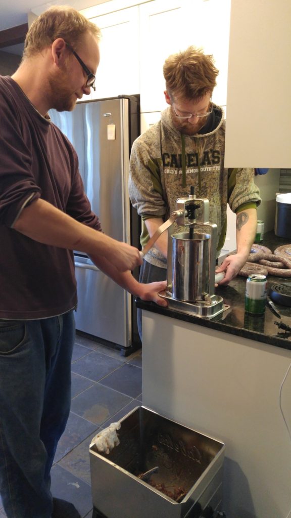 Kyle & Davis stuffing sausages