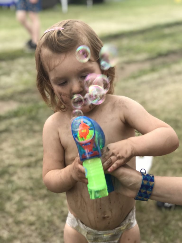 Piper Playing with Bubbles and Dirt