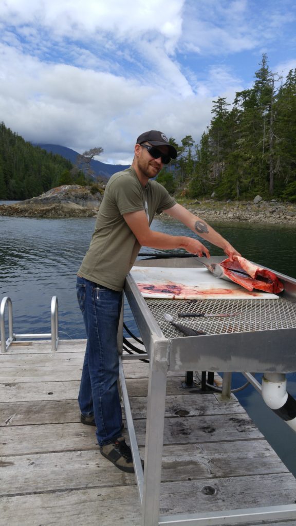 Kyle cleaning salmon