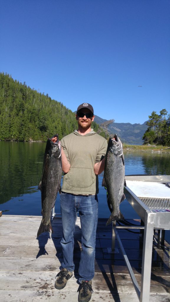 Kyle holding 2 of the 3 salmon caught that morning