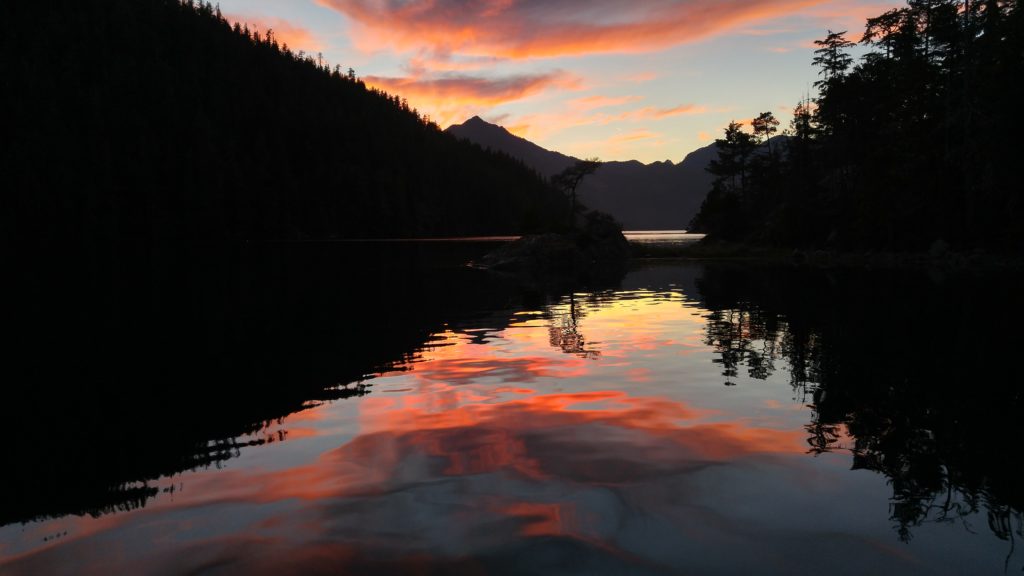 View from cabin at sunset with glassy water