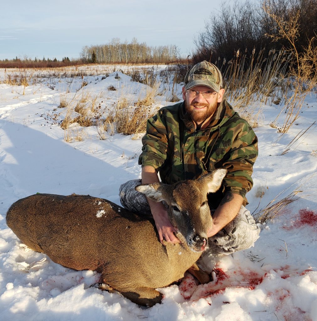 Kyle with whitetail doe